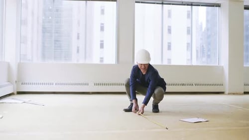Architect Measuring Empty Office Space Adult