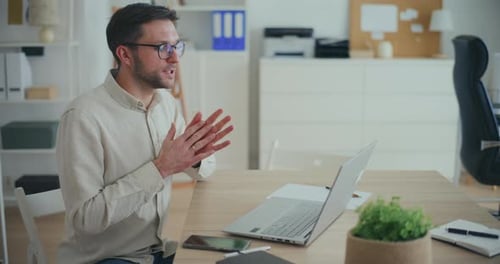 Man Having Video Call Online Meeting In Office