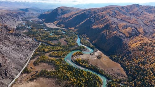 Meandering river in a scenic autumn mountain valley