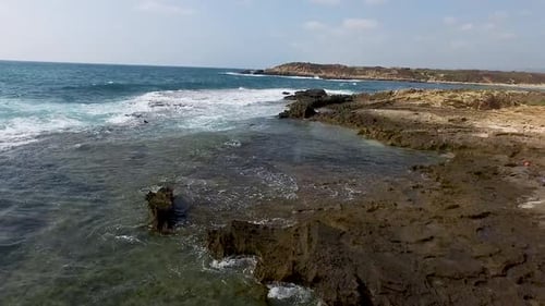 Drone flying above rocks island Full HD