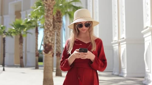 Woman with Smartphone Walking on Turkish Entertainment Park