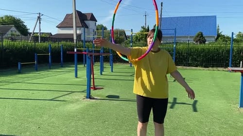 A Female Athlete Works Out at the Sport Area in the Morning