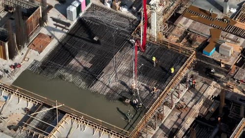 Construction Workers During Concrete Pouring At The Construction Site In Vancouver, Canada. aerial t