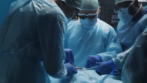 Surgeons Performing Operation in Hospital Operating Room