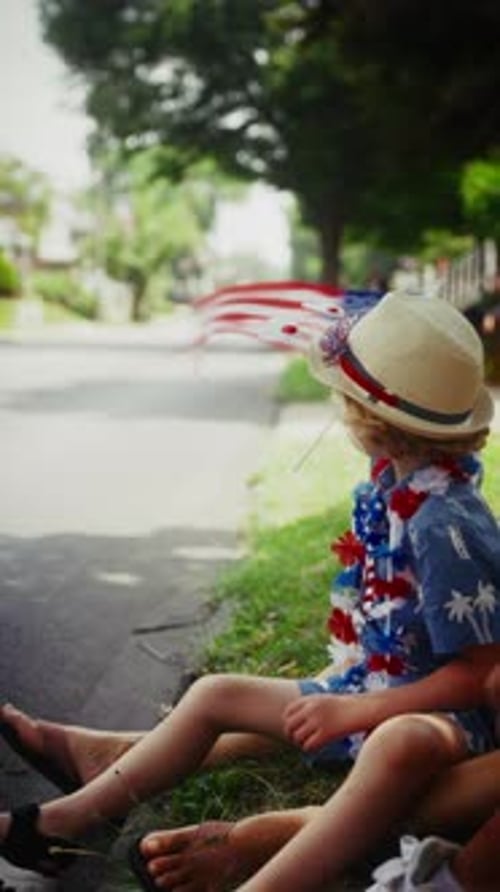 Child Waves Flag on Fourth of July