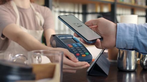 Pay By Phone On Pos Terminal At Coffee Bar. E-Money Transfer From Electronic Wallet Of Client. Pa...