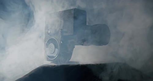 Vintage Film Camera Surrounded by Smoke in Dark