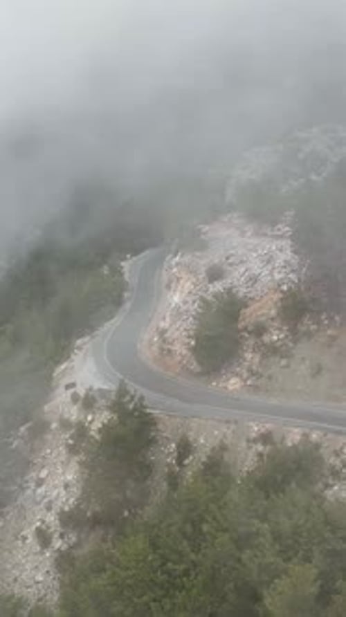 Vertical Video Cloudy Landscape in the Mountains Aerial View