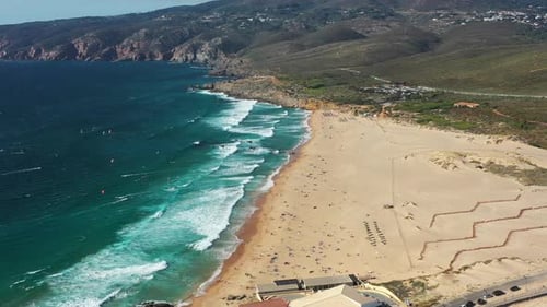 Aerial Drone View of Sandy Beach with Turquoise Sea Waves Crashing on Shore