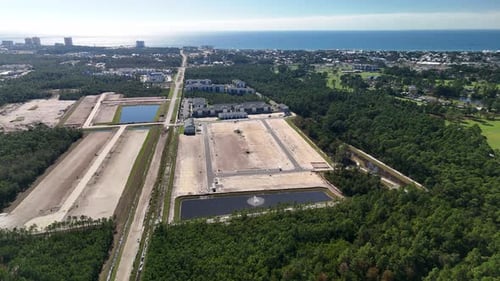 Panama City, Florida, USA - A Developing Neighborhood With Land Plots, Buildings, and a Retention Po