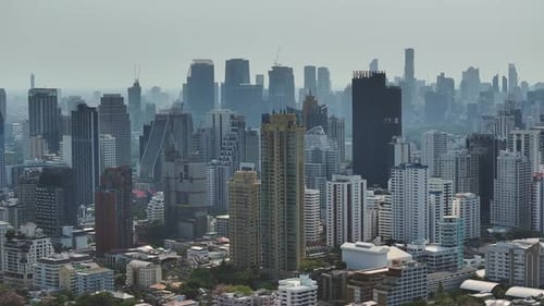 Aerial view of Bangkok skyline featuring high-rise buildings and urban landscape