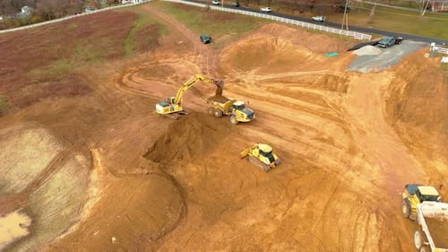 Construction Equipment Working on Earthmoving Site