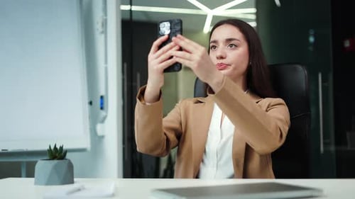 Woman Worker Holding Smartphone and Catching Connection at Modern Office