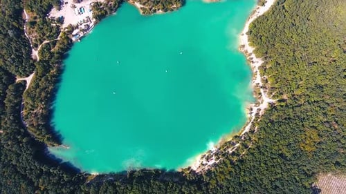 Breathtaking scenery over the turquoise lake in the middle of the thick woods.