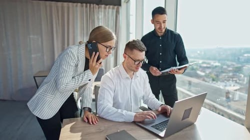 Team Collaboration in Modern Office with City View