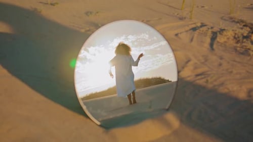 Woman in White Dress Reflected in Desert Mirror