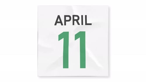 April 12 Date Behind Torn Page of a Calendar