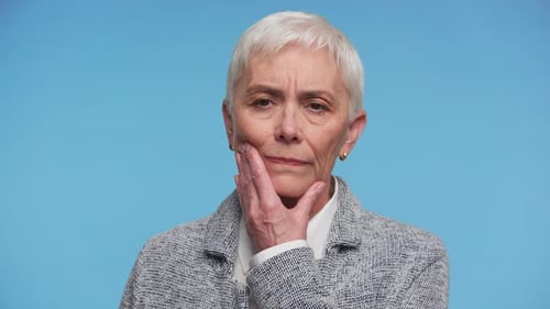 Senior Woman Suffering From Tooth Pain