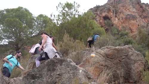 Hikers group walk along a rout in the mountain.