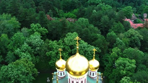 Close aerial view of the memorial church Birth of Christ near Shipka, Bulgaria surrounded by green t