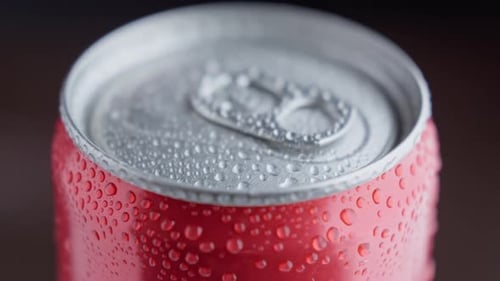 Refreshing Red Soda Can with Condensation Close-Up