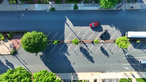 Cinematic Top Down View of City Street Traffic and Sunny Shadows