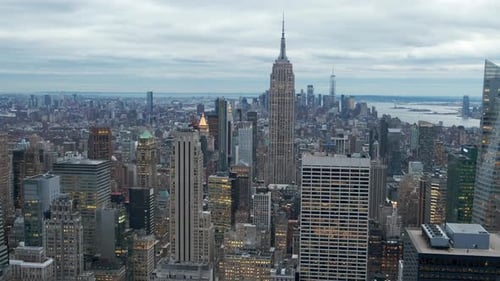 Pan Across Manhattan Skyline With Empire State Building At Dusk