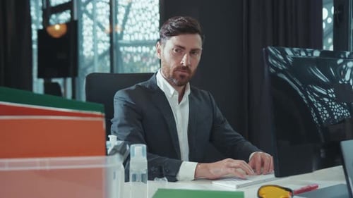 Young Man Office Worker Use Computer Look on Box with Office Stuff From His Table Feel Sad Fired Due