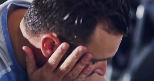 Exhausted Man with Sweat from Gym Workout
