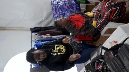 Women Getting Ready in Tent Dressing Room