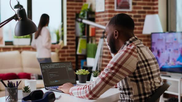 African American Software Developer Works on Programming Code on a ...