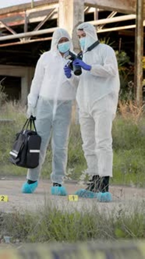 Investigators Photographing Crime Scene Evidence