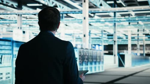 Writing Code Tablet Closeup and Engineer in Data Center