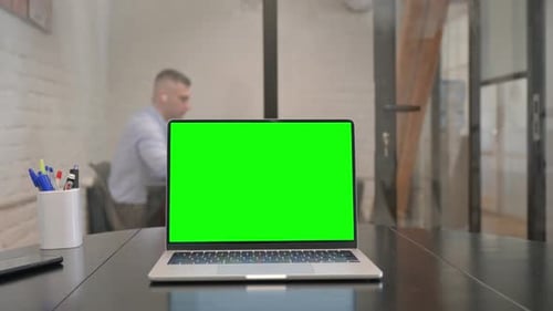 Laptop with Chroma Key Screen on Desk