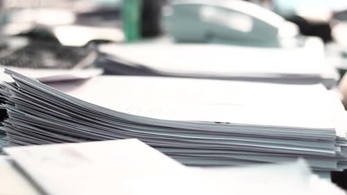 Stack of White Paper on White Desk