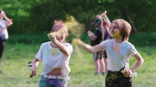 Youth Celebrate Holi Festival with Powder in Park
