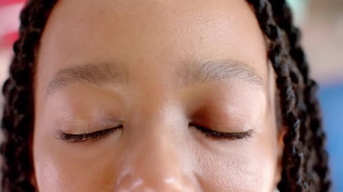Portrait of happy eyes of african american casual businesswoman in office