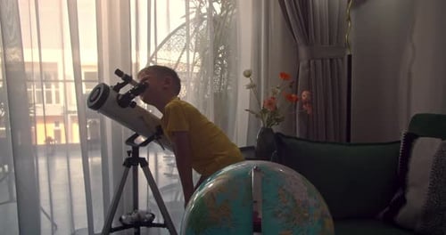 Cute Child Watching Stars Through a Telescope at Night Close Up Face of Curious Kid Using Telescope