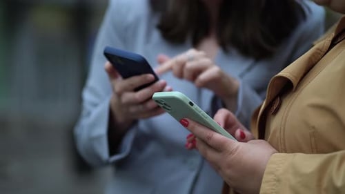 Close Up Focus on Females Hands Using Phones
