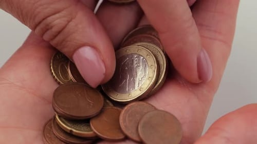 Sorting Through Euro Coins in Hand