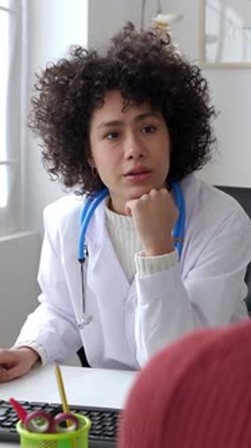 Doctor and Patient Talking in a Medical Consultation in a Clinic