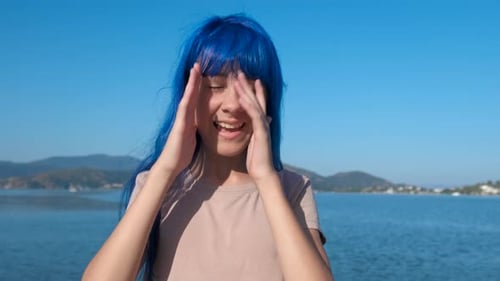 Hopeful Blue Teen By Sea