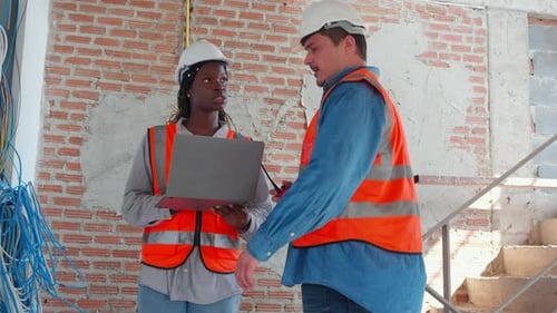 Team of architect or engineer looking laptop computer for inspection and planning construction.