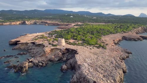 mediterranean coastal sunset ancient historic tower. Nice aerial top view flight wide orbit overview