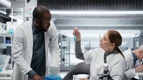 Scientists at work in laboratory analyzing samples
