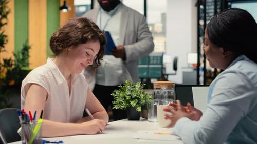 Professional Candidate Fills Out Onboarding Documents and Signs Contract Terms