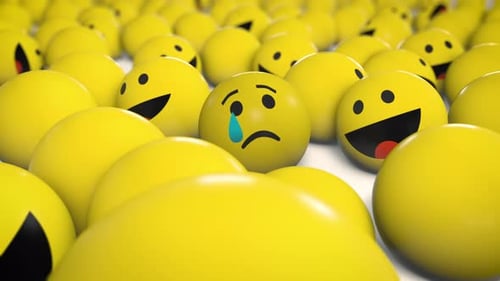 Crying Sad Emoji Surrounded by Happy Emojis