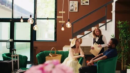 Receptionist Talking to Hotel Guests