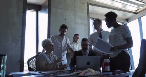 Office Team Brainstorming and Collaborating in Modern Office