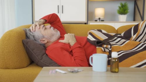 Sick old man lies down.